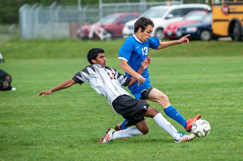 Luke Zuzarte, l., goes for a slide tackle in a home game against Ferndale May 1. Photo by Janell Kortlever